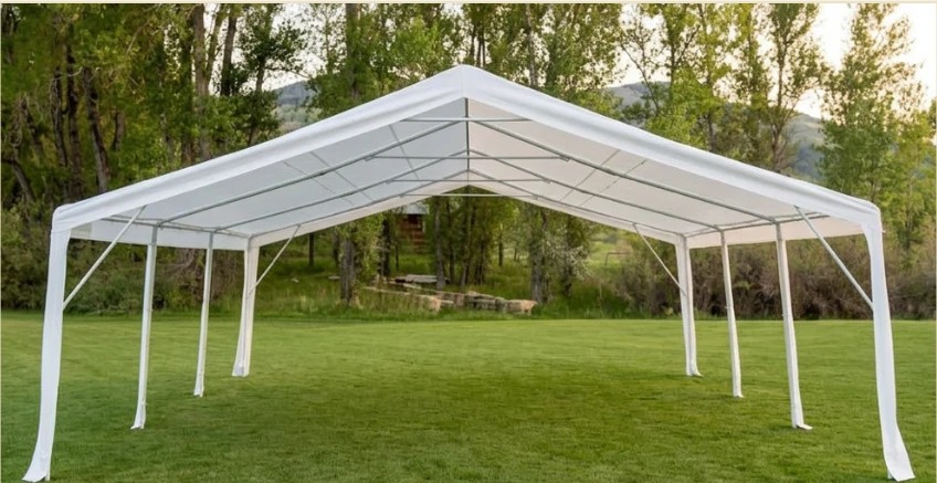 White open-air event canopy tent set up on a grass lawn